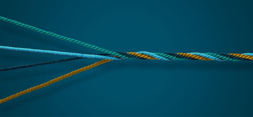 Several strands of yarn coming together to form one solid, durable rope, symbolizing the strength and stability that comes from balance and togetherness