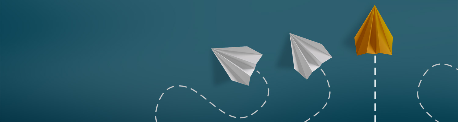 Image of paper planes flying in different patterns with one flying straight, representing the importance of predictability