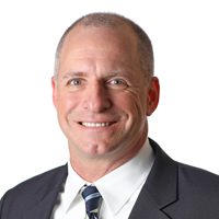Professional headshot photo of Jerry Brennan