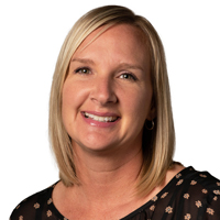 Professional headshot photo of Kelly Peremba